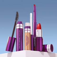 COVERGIRL lifestyle shot applying liner at mirror to show on-the-go touch-up ease