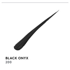 COVERGIRL liner next to coin showing compact size and travel-ready convenience