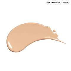 COVERGIRL in-use by model at mirror illustrating easy application and brightening effect