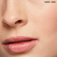 COVERGIRL applying concealer under eye illustrating brightening effect