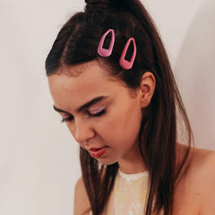 Cptots clip securing bangs in place demonstrating secure hold without pulling