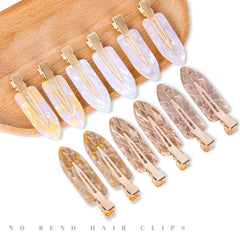 Cptots close-up of flat clip surface, smooth finish protects hair from dents