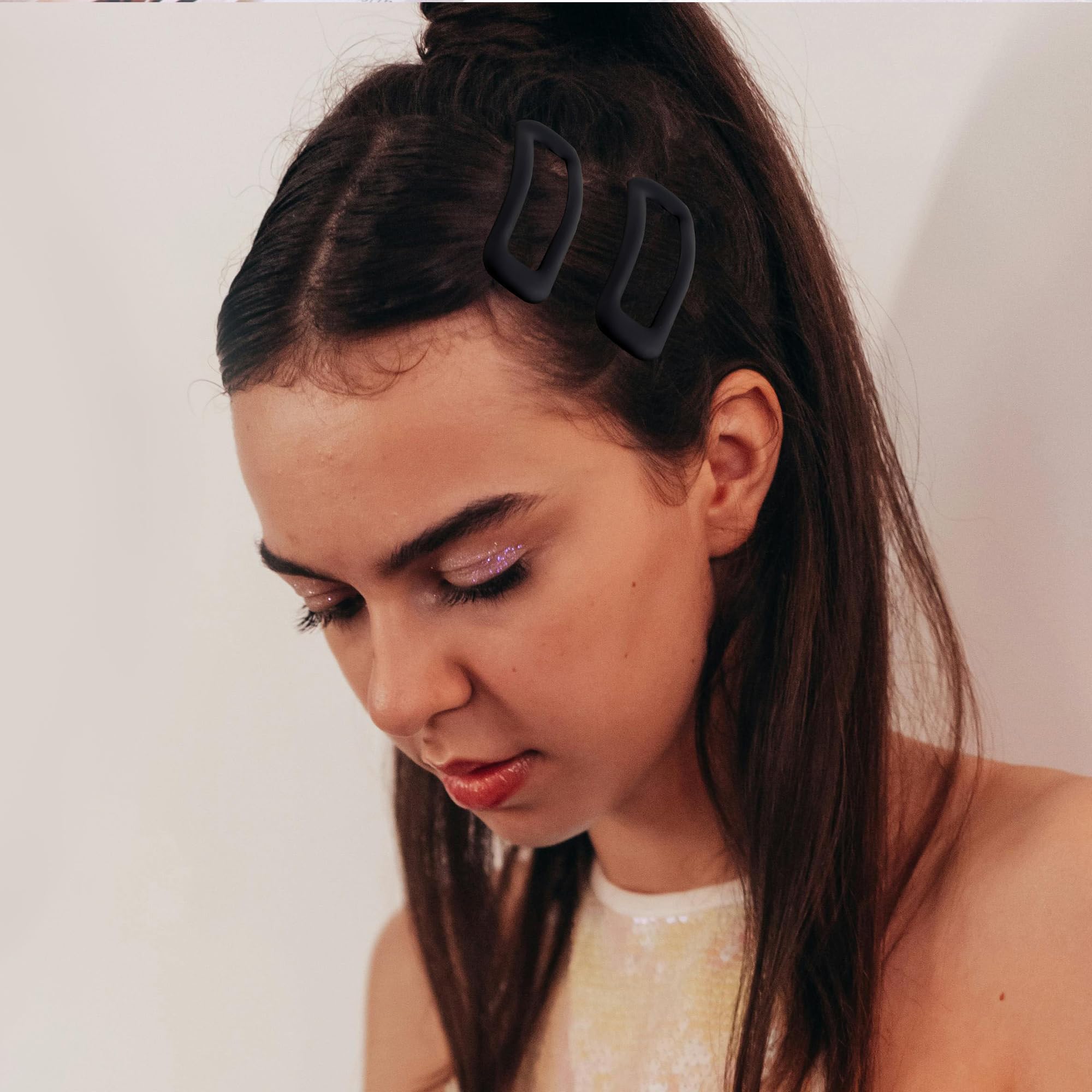 Cptots clip holding bangs in place showing discreet secure styling benefit
