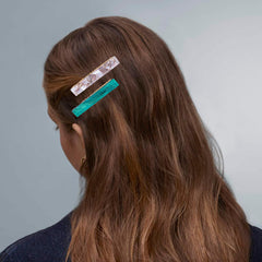Cptots clips on a makeup table showing convenience during skincare routines