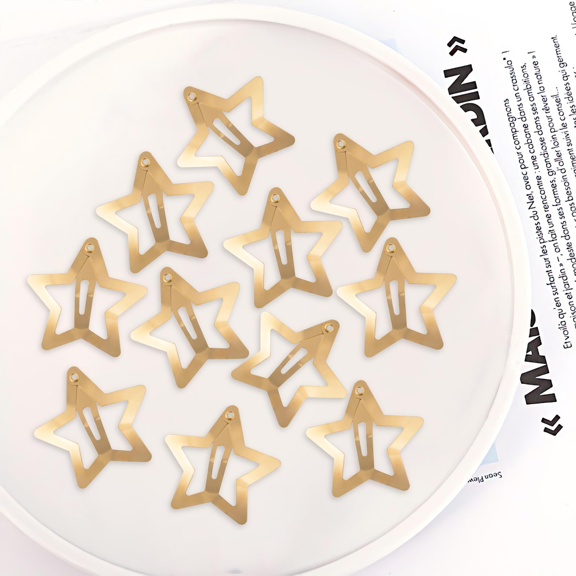 Cptots star clips held in hand to show 1.25 inch scale and easy use