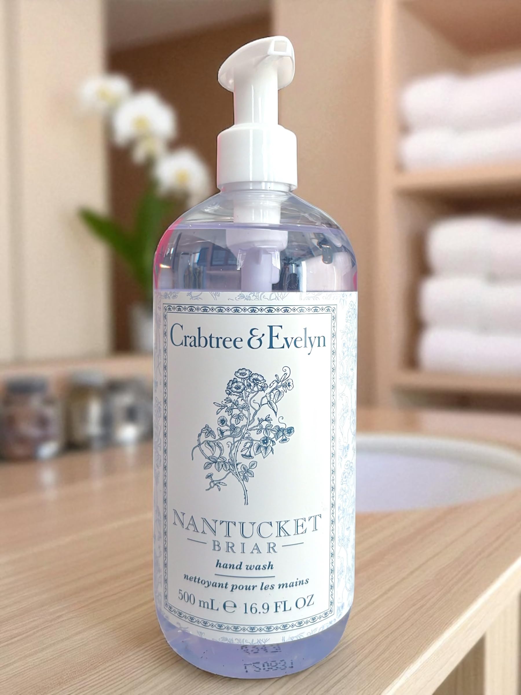 Crabtree & Evelyn bottle staged on bathroom counter, suggests everyday luxury