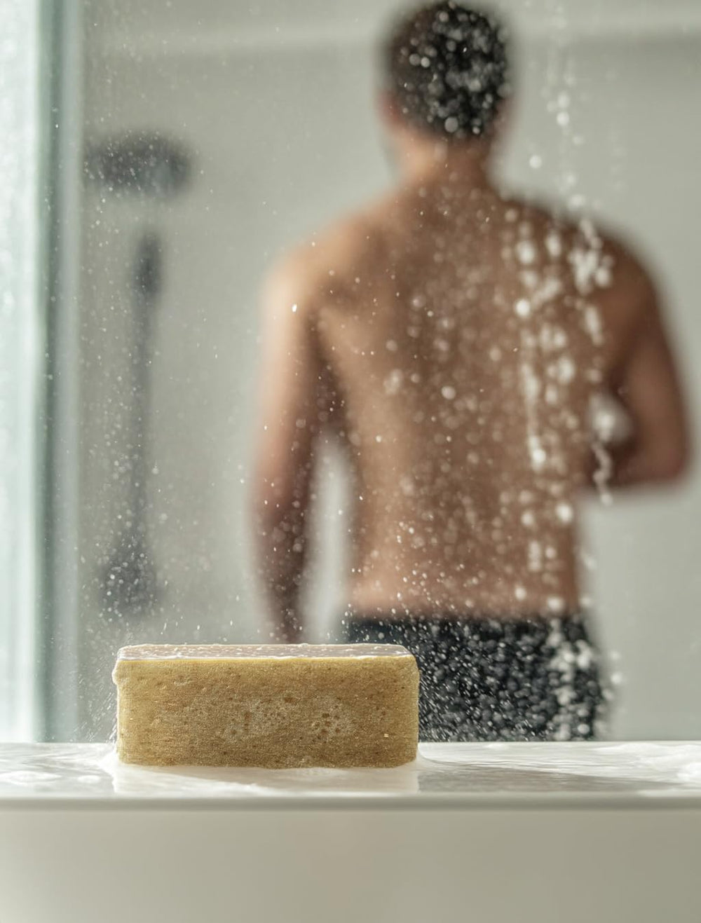 Crate 61 Organics lather in hand demonstrating rich foam and gentle cleaning benefit
