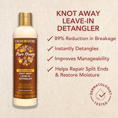 Creme of Nature product in hand applied to curly hair for easier combing