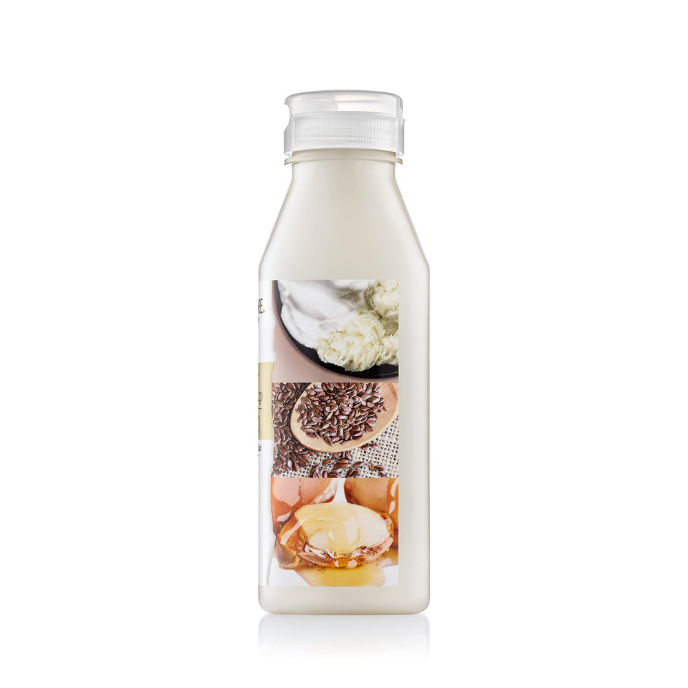 Creme of Nature pump and label close-up highlighting ingredients