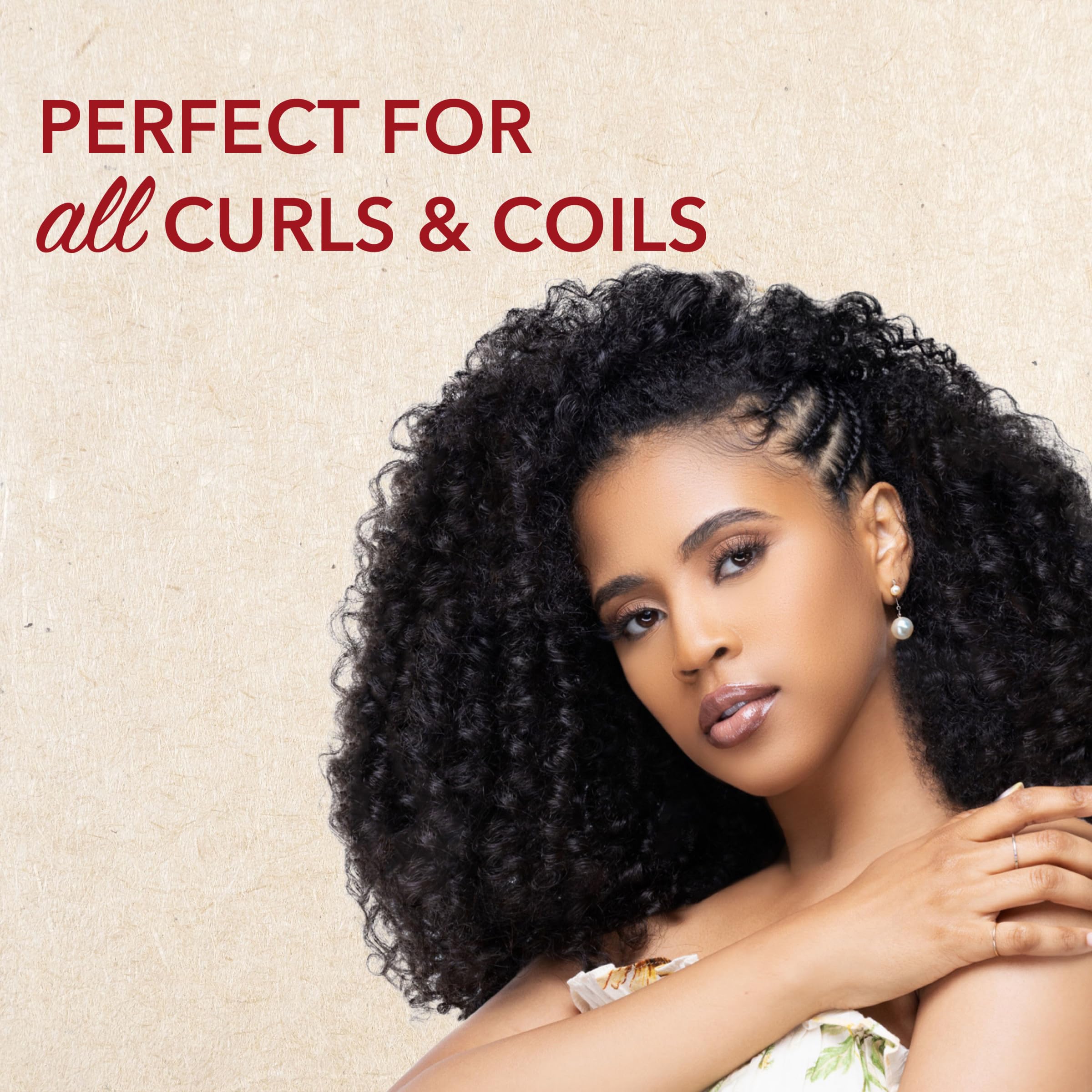 Creme of Nature label close-up highlighting coconut oil ingredient and natural claim