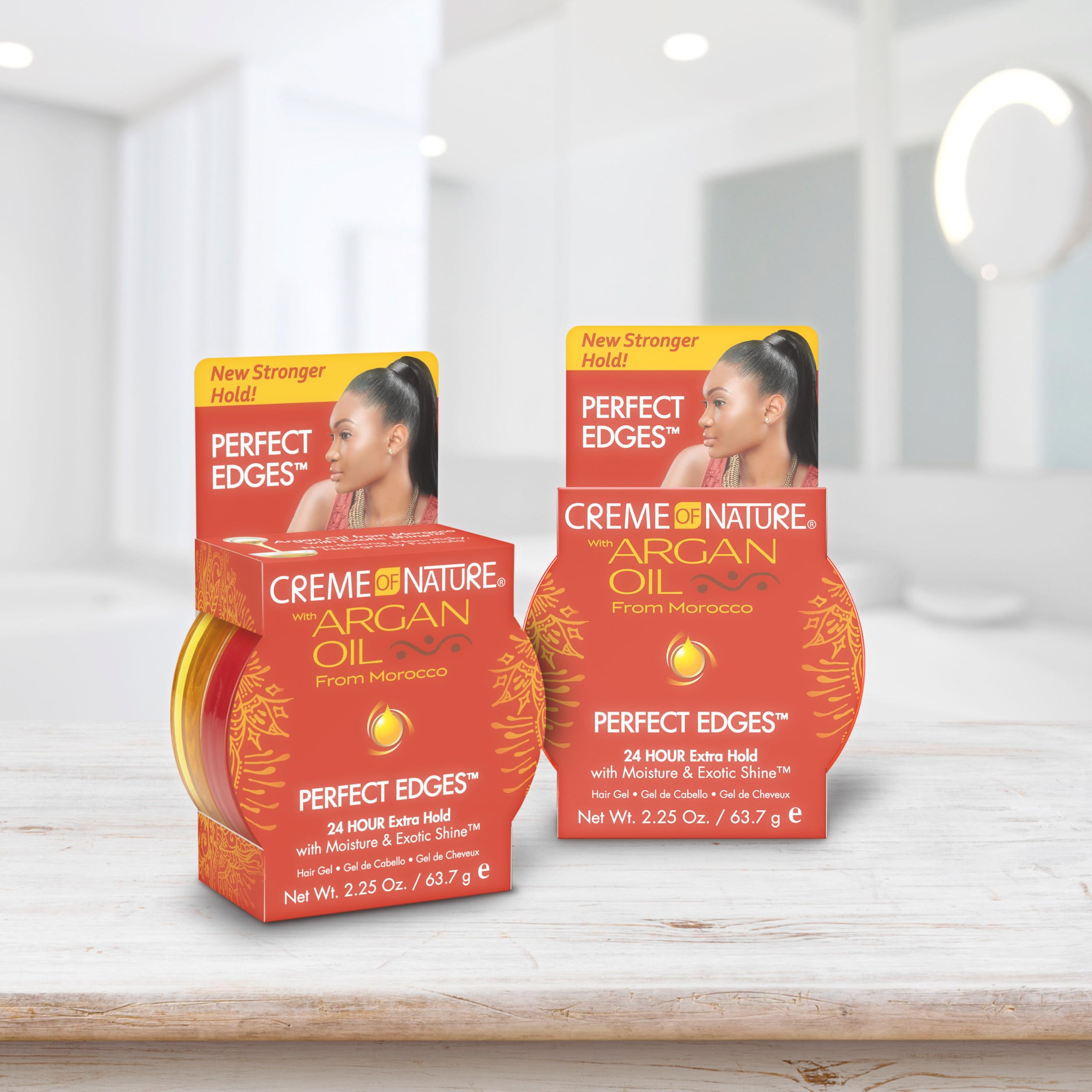 Creme of Nature applying gel with brush for precise edges