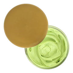 Creme of Nature close-up of cream texture on fingertip, demonstrates smooth moisture delivery