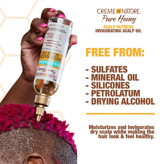 Creme of Nature oil poured to show texture and quick-absorbing benefit