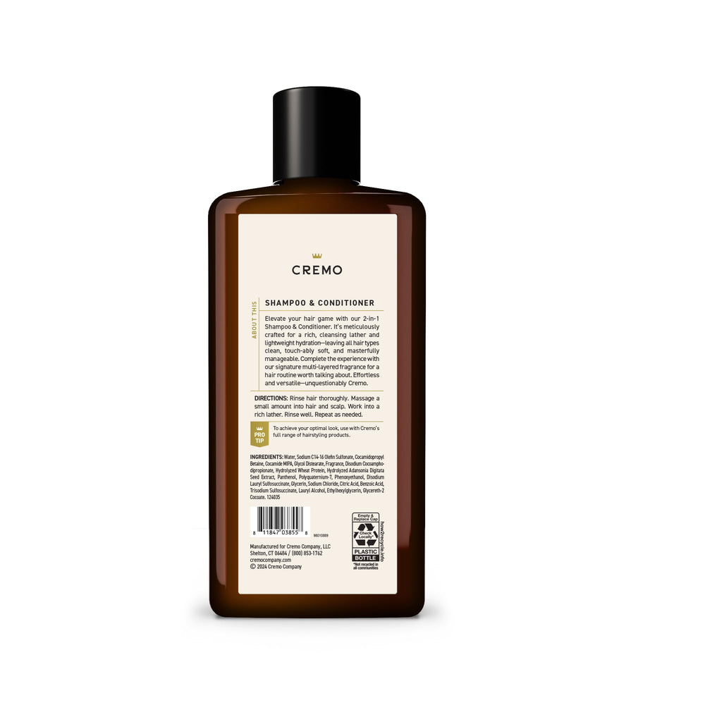 Cremo 16 fl oz bottle next to a hand for size and travel-friendly convenience benefit