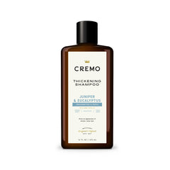 Cremo bottle front view showing label and benefit of thicker-looking hair
