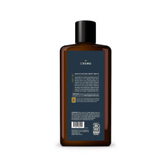 Cremo lifestyle bathroom setup with bottle and towel conveying elevated grooming routine benefit
