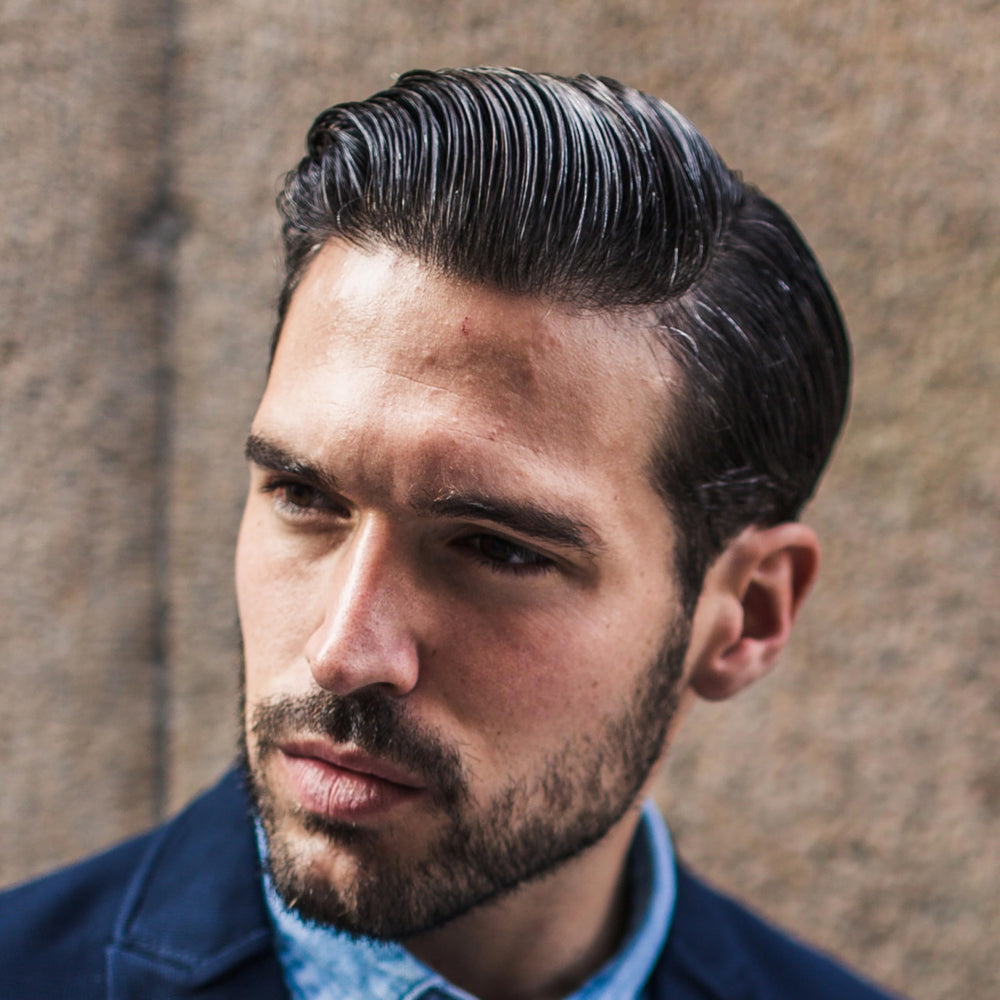 Cremo pomade on hands demonstrating easy workability and spreadability