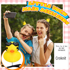 Croknit duck clips secured in braid demonstrating playful styling and hold