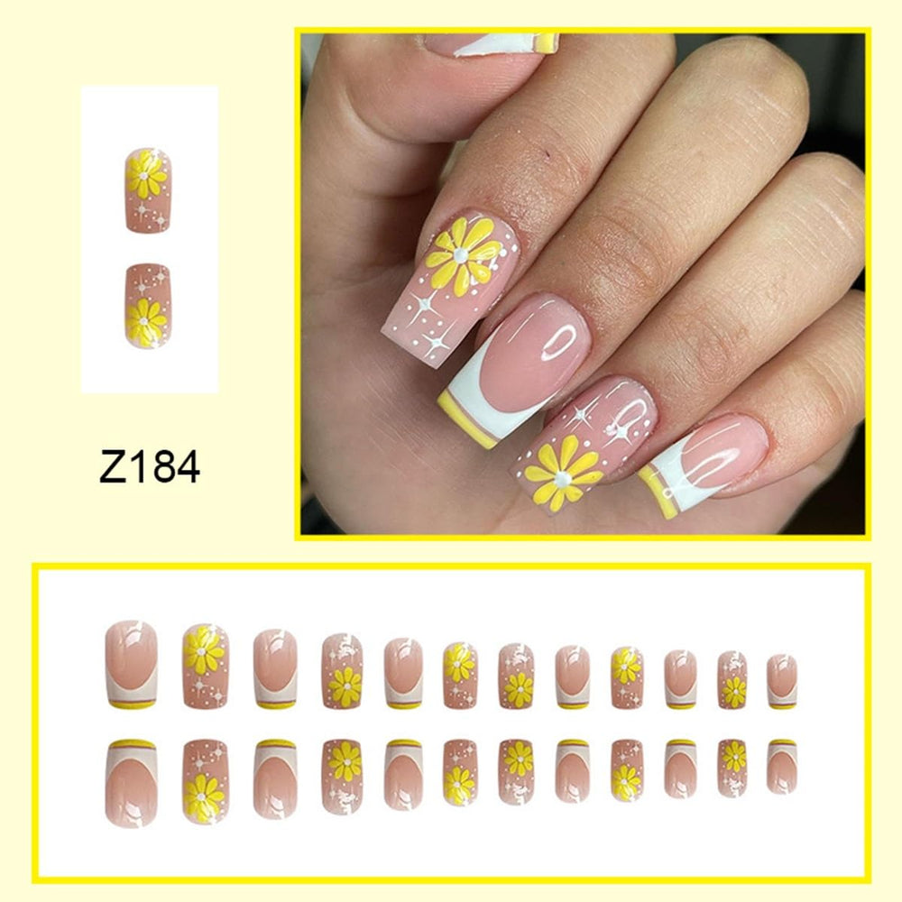 CTTHNBD close-up of French tip with yellow flower for precise design detail and chic look
