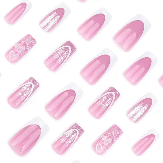 CTTHNBD close-up of tiny heart detail on pink nail delivering delicate, feminine style