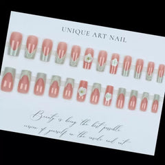 CTTHNBD on a hand model demonstrating how the green French tips appear when worn