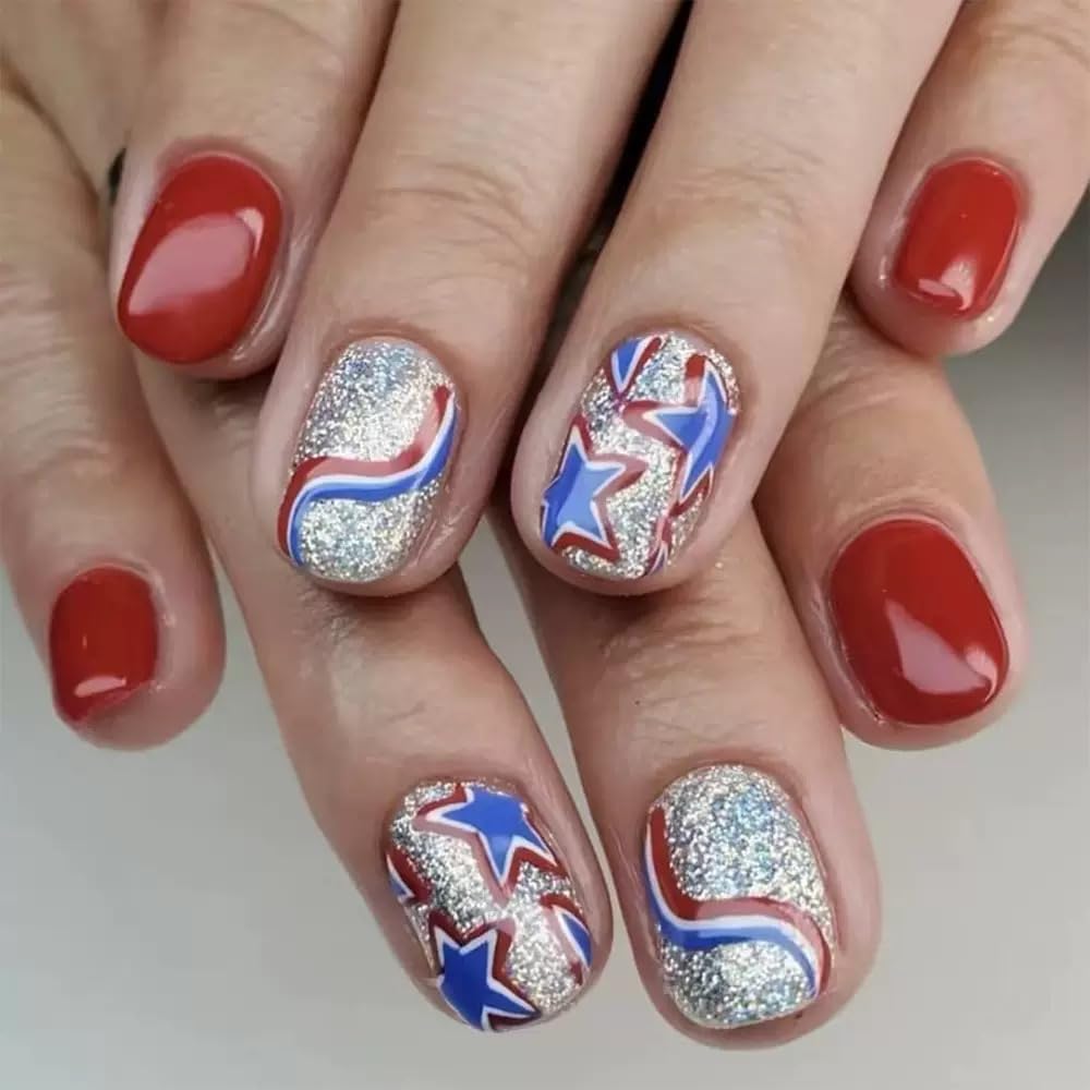 CTTHNBD hand wearing short square red and blue nails demonstrating comfortable everyday use