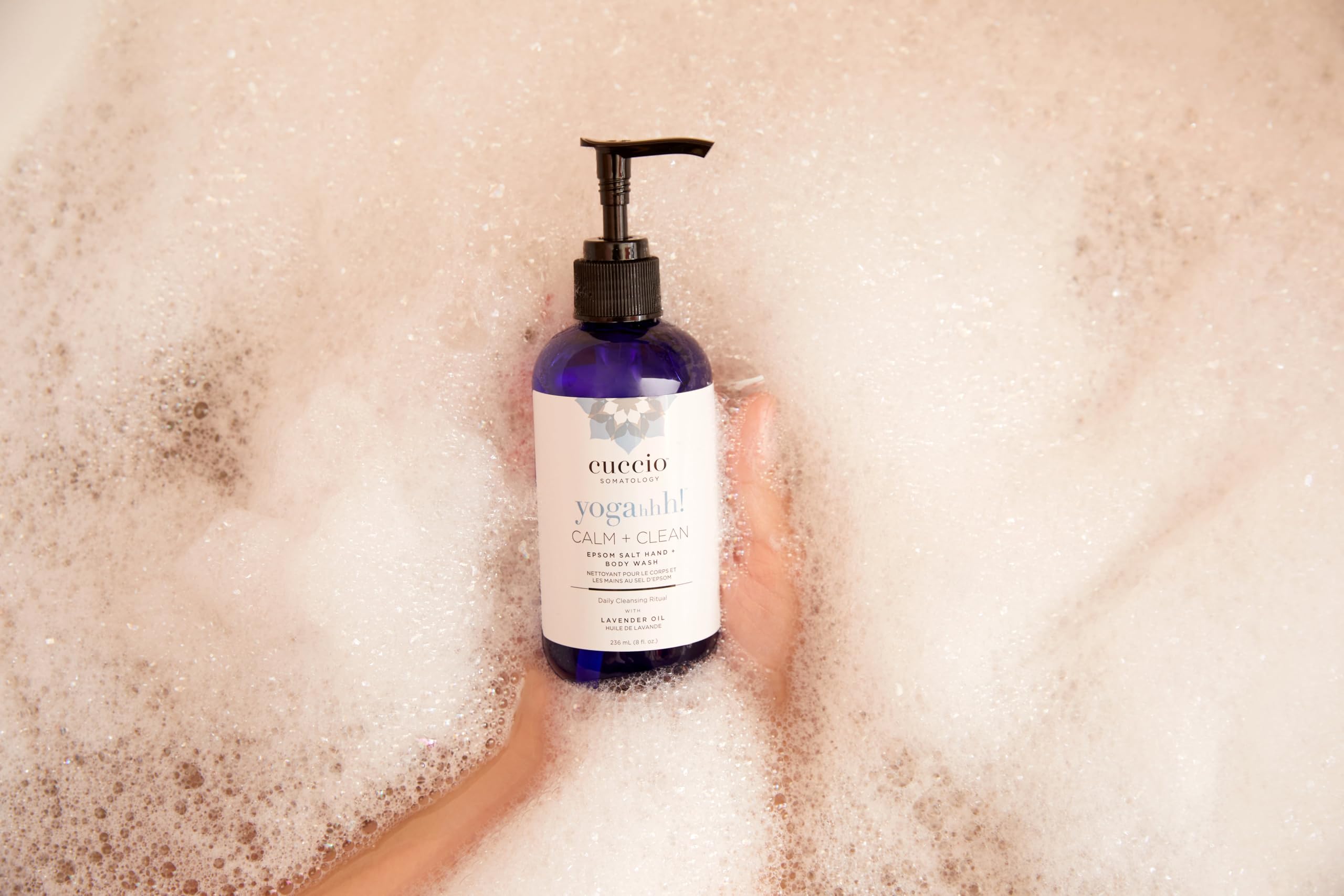 Cuccio arranged ingredients Epsom salt lavender and shea butter highlighting natural calming benefits