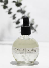 Cuccio on vanity near towels demonstrating salon-quality at-home nail care