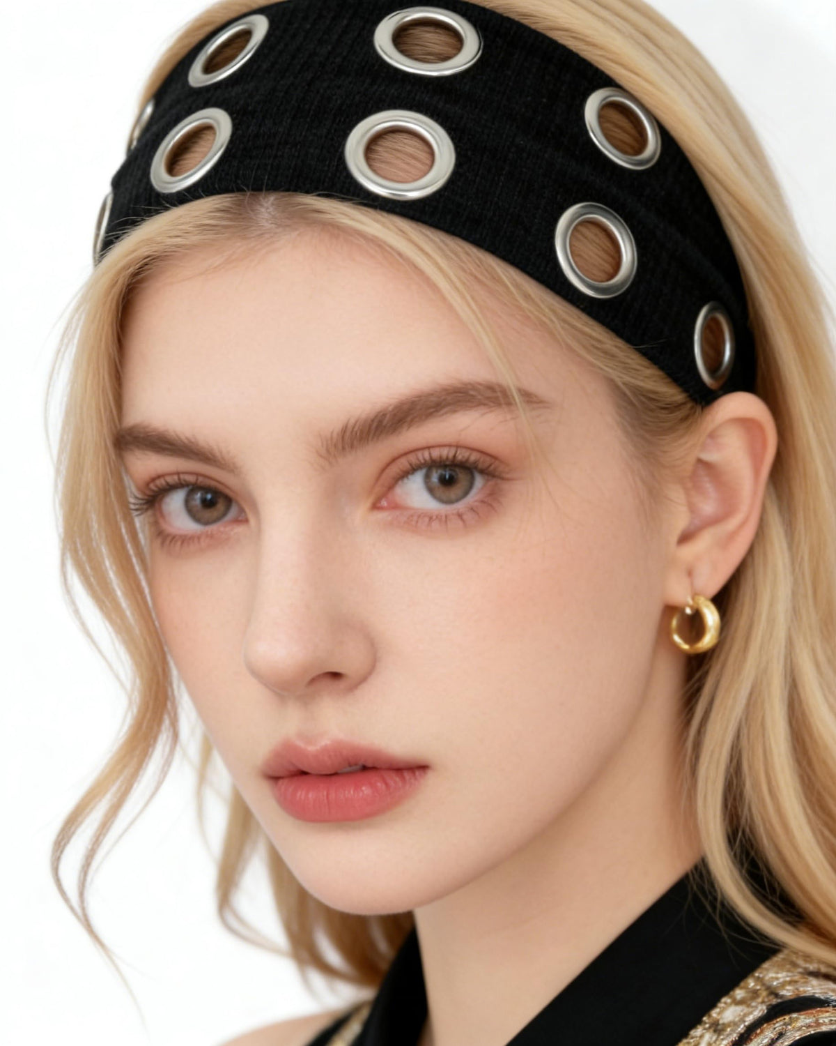 Cupeou front view of wide black headband showing bold eyelet design and confident look