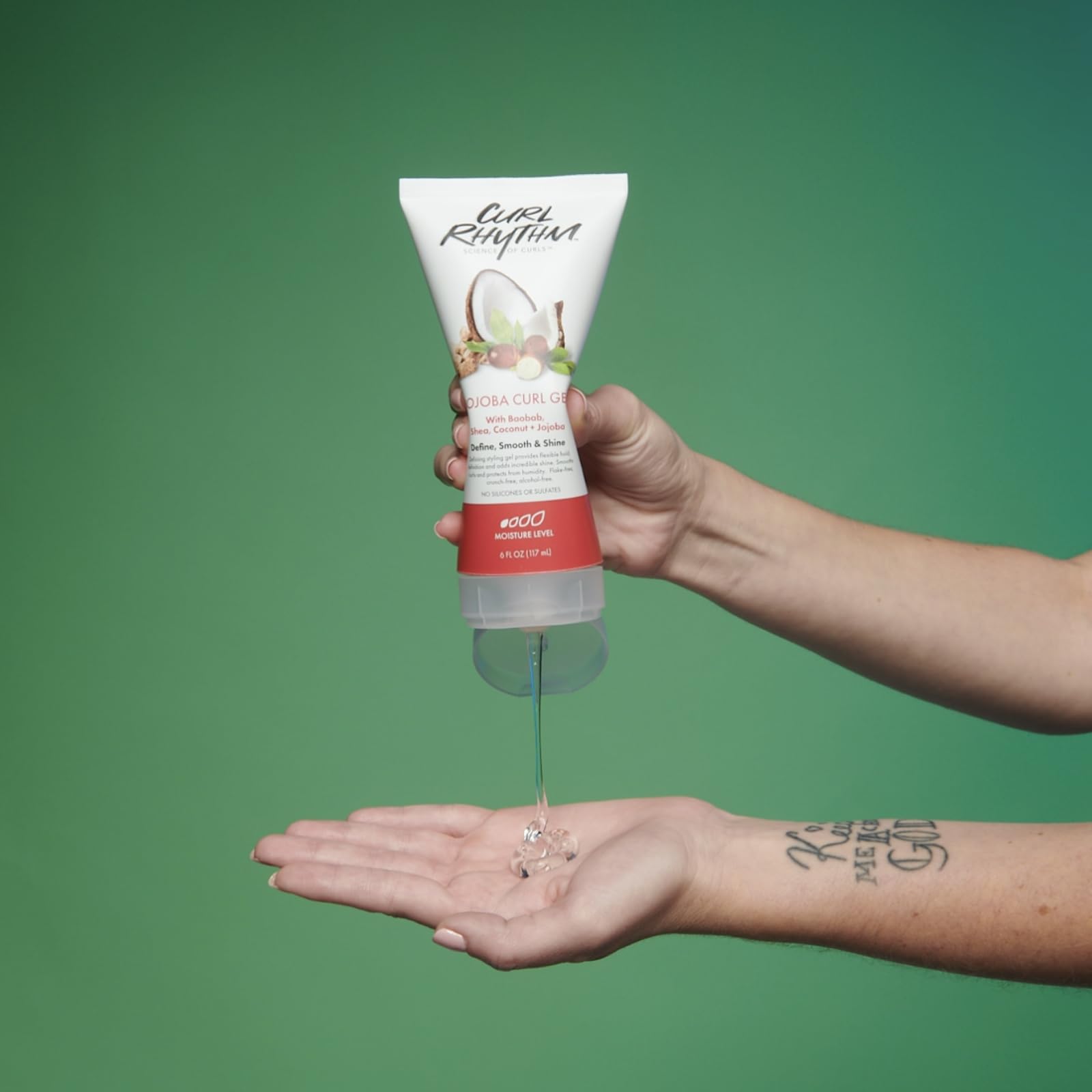 Curl Rhythm 6 oz container next to hand for size and scale