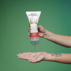 Curl Rhythm 6 oz container next to hand for size and scale