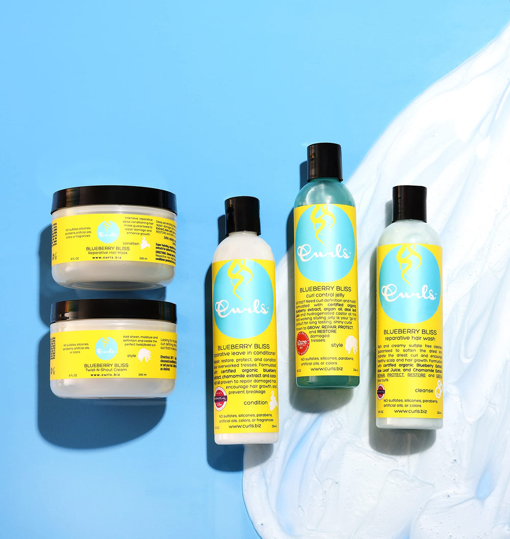 Curls bottle on vanity with styling tools conveying everyday use and curl-friendly routine