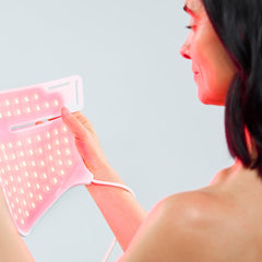 CurrentBody mask in use on a model demonstrating chest and neck coverage benefit