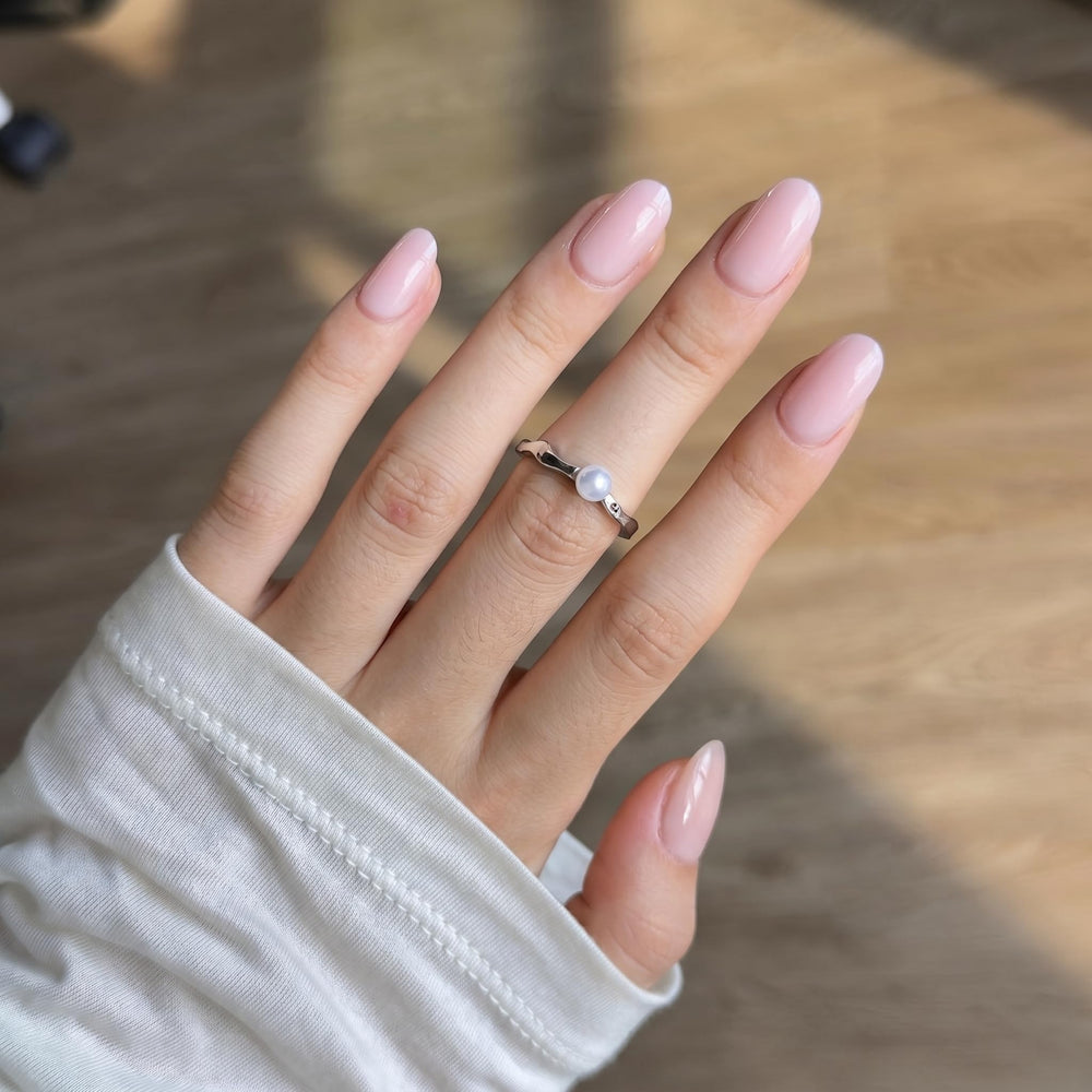 CurvLife close-up of almond-shaped nail showing soft-gel texture and glossy shine