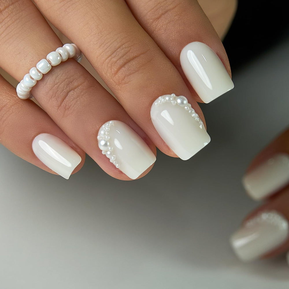 Curvlife close-up of 3D pearl crescent detail on French tip, elegant accent