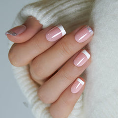 Curvlife close-up of silver glitter fade French tip highlighting fine detail