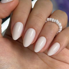 Curvlife front packaging shows milky white press on nails and tools for quick application
