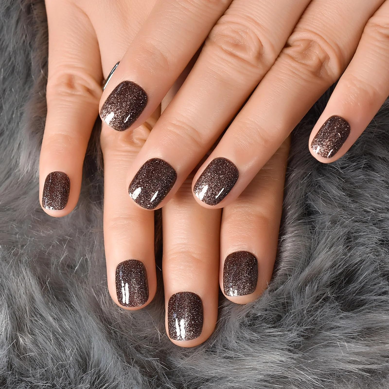 Curvlife nails in hand demonstrating size and natural short length benefit