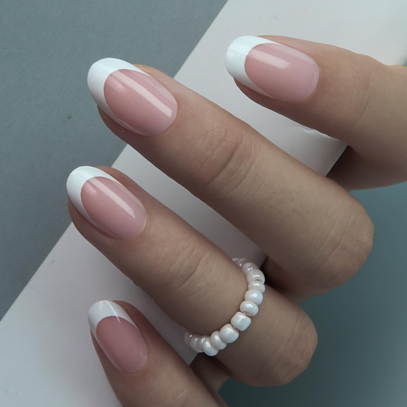 CurvLife hand applying a press-on nail demonstrating quick, secure at-home application
