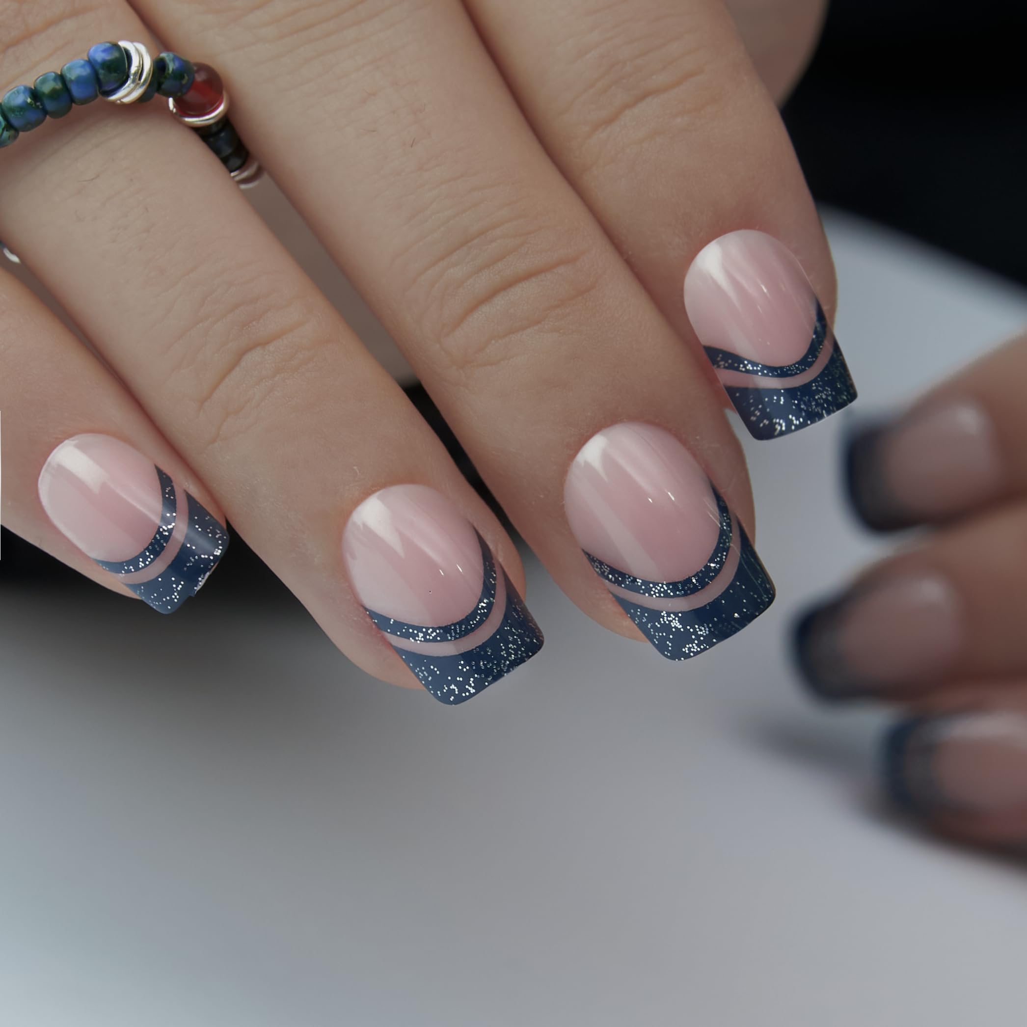 CurvLife hands applying a press-on nail quickly to show easy five-minute application