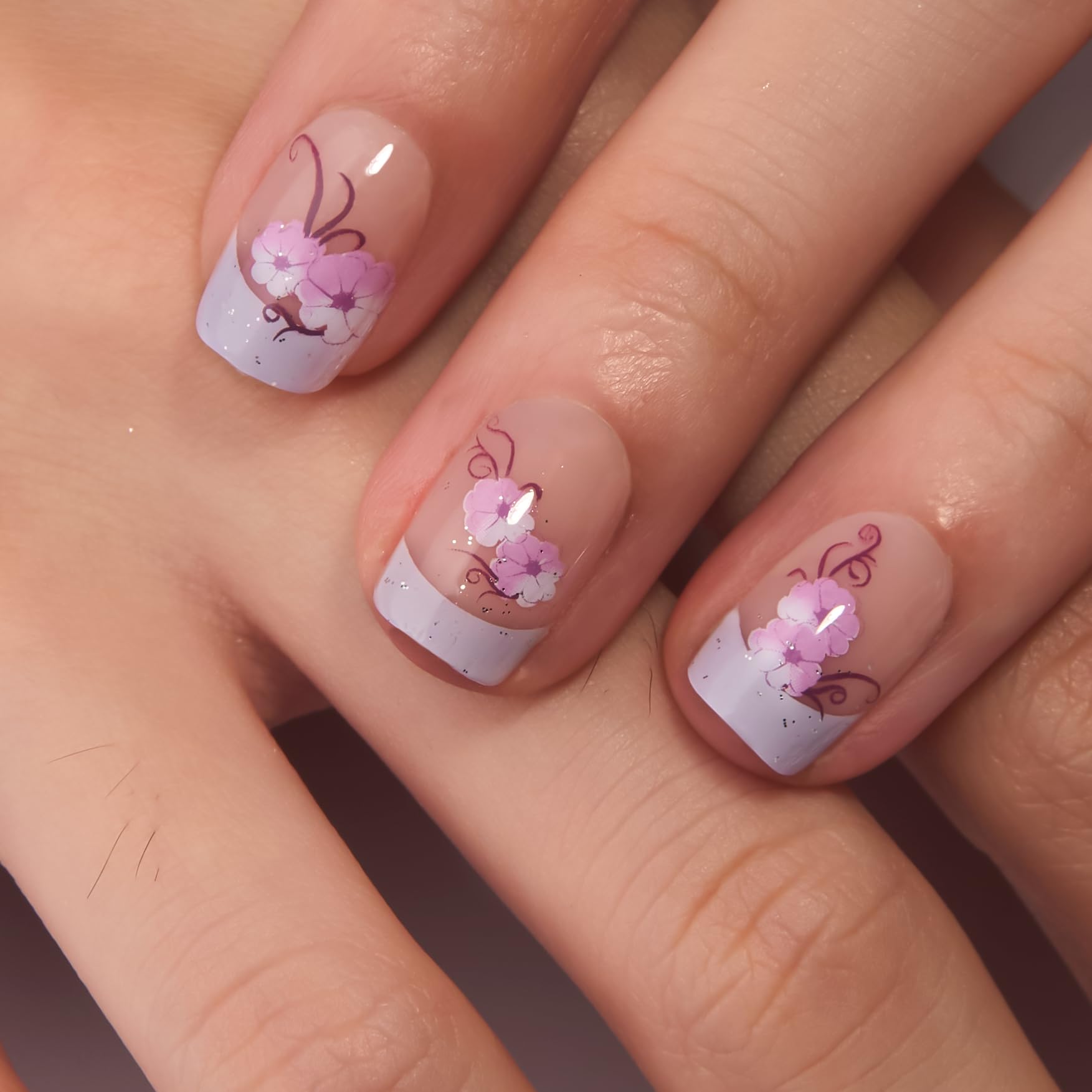 CurvLife close-up of nail surface and purple floral detail highlighting smooth gel finish and realism