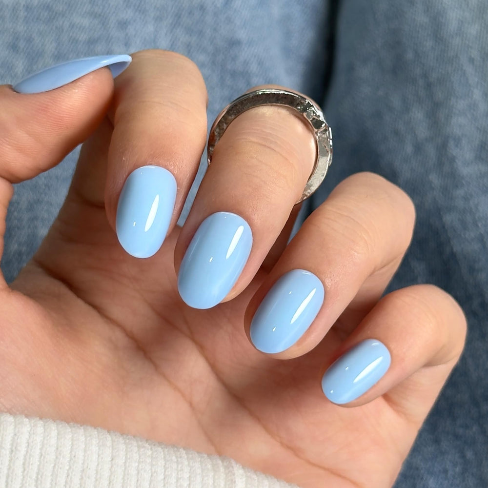 CurvLife nails applied while typing, showcasing comfortable, natural fit