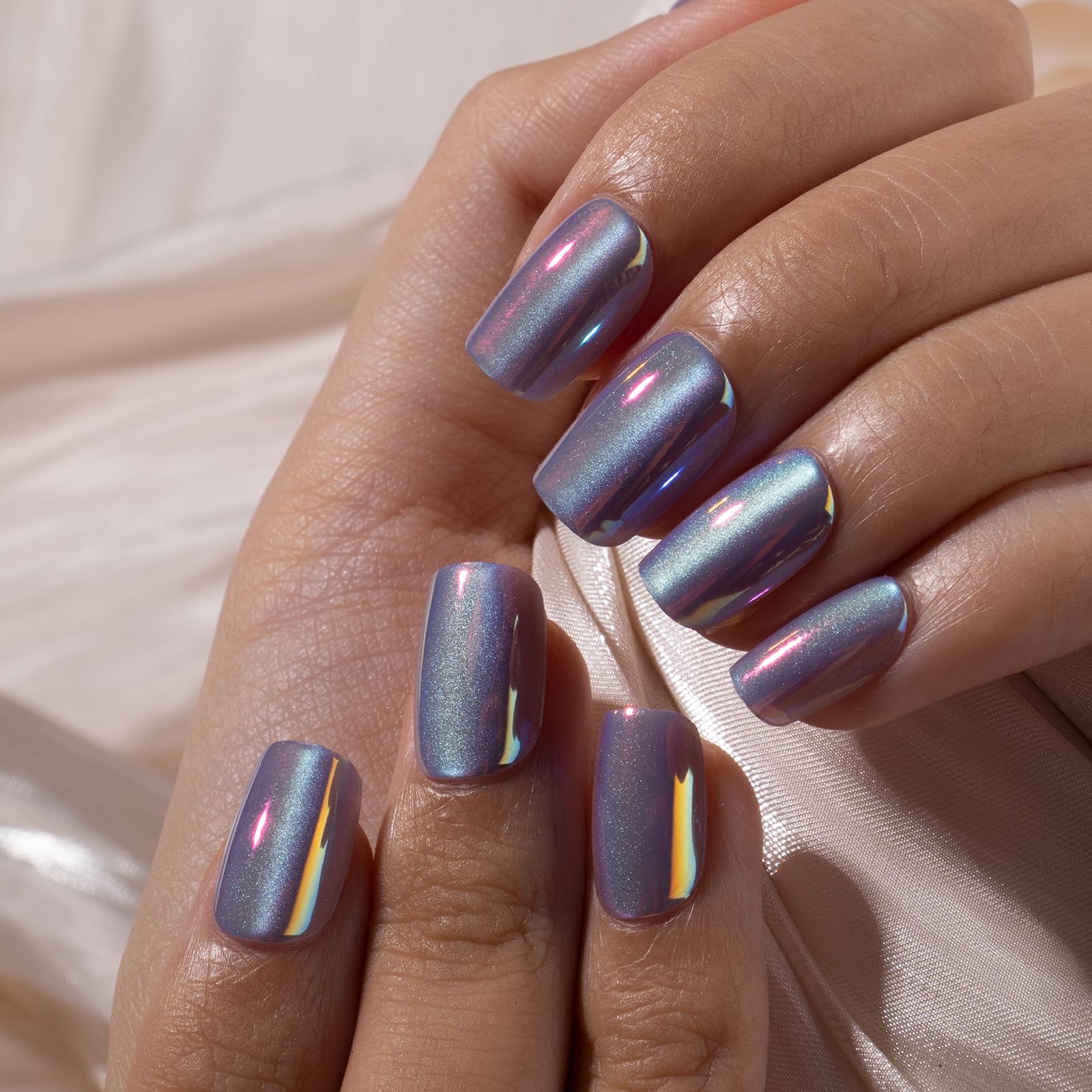 CurvLife nails on hand for scale illustrating full-cover shape and fit comfort