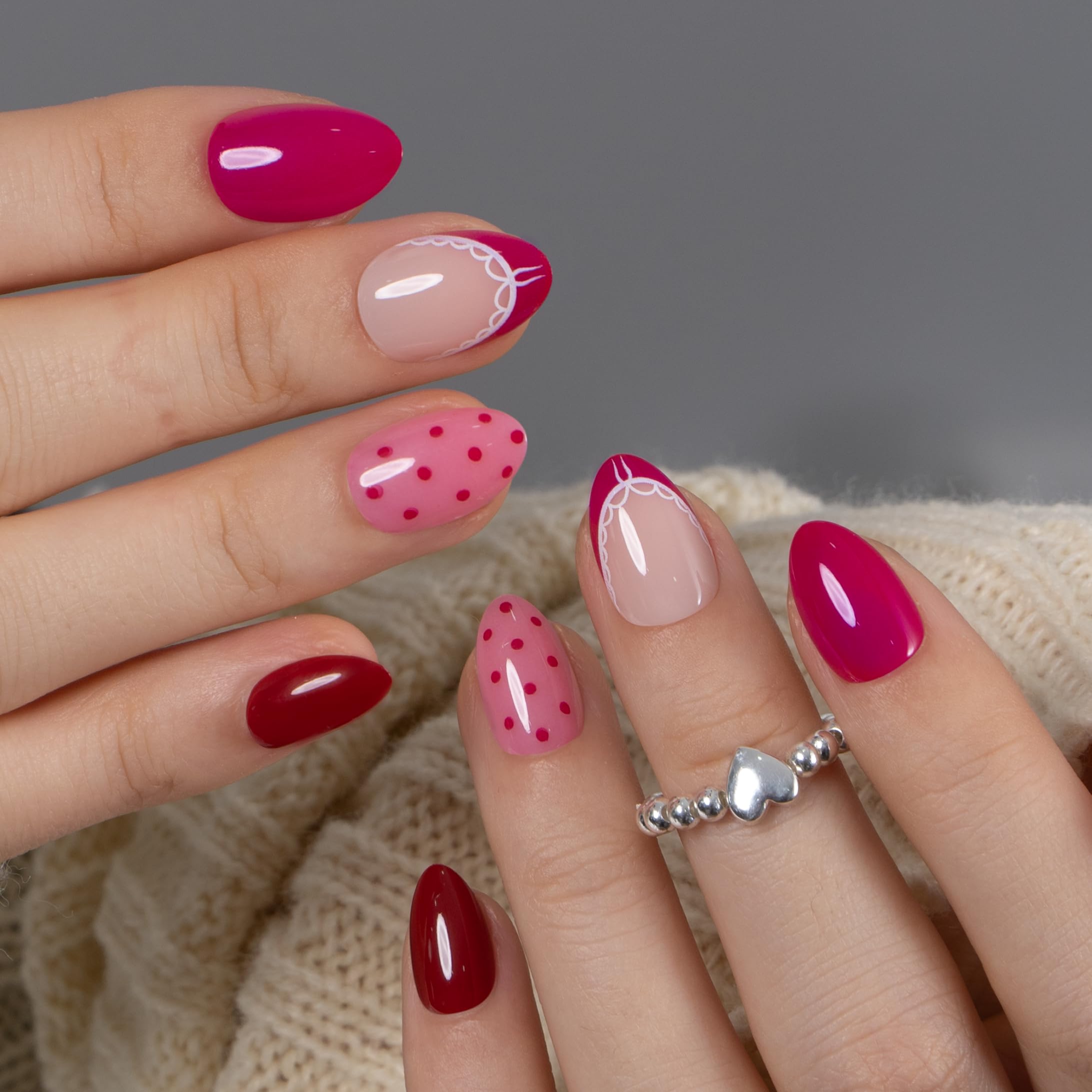 CurvLife press-on nails held in hand showing scale and comfortable short length