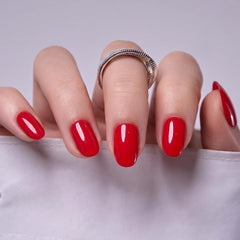 Hand holding CurvLife nails to show scale and quick application benefit for short nails