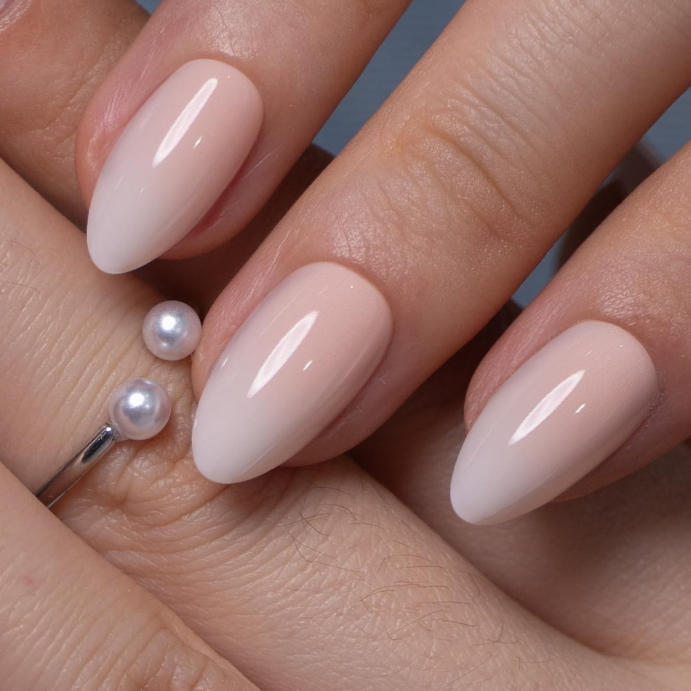 CurvLife single press-on nail on finger showing short almond scale and natural look benefit