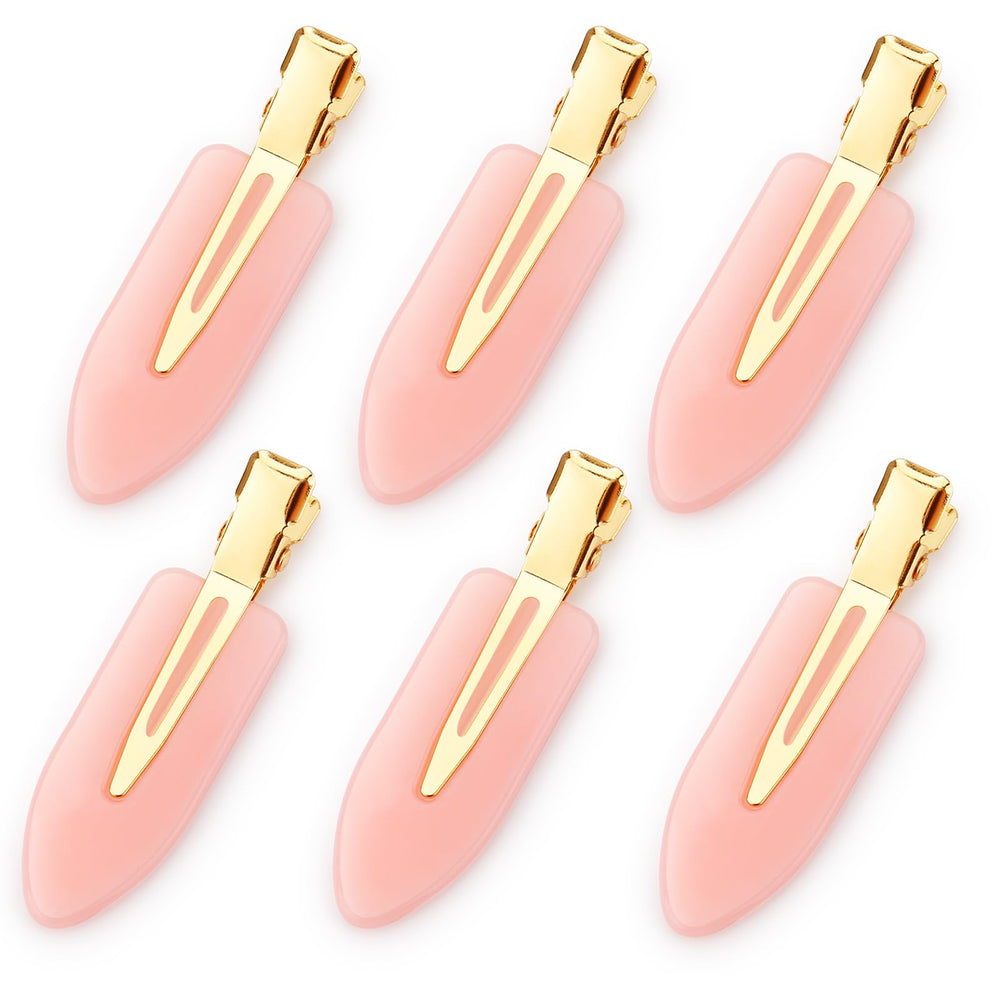 D brand clip front view showing pink body and golden handle, professional aesthetic