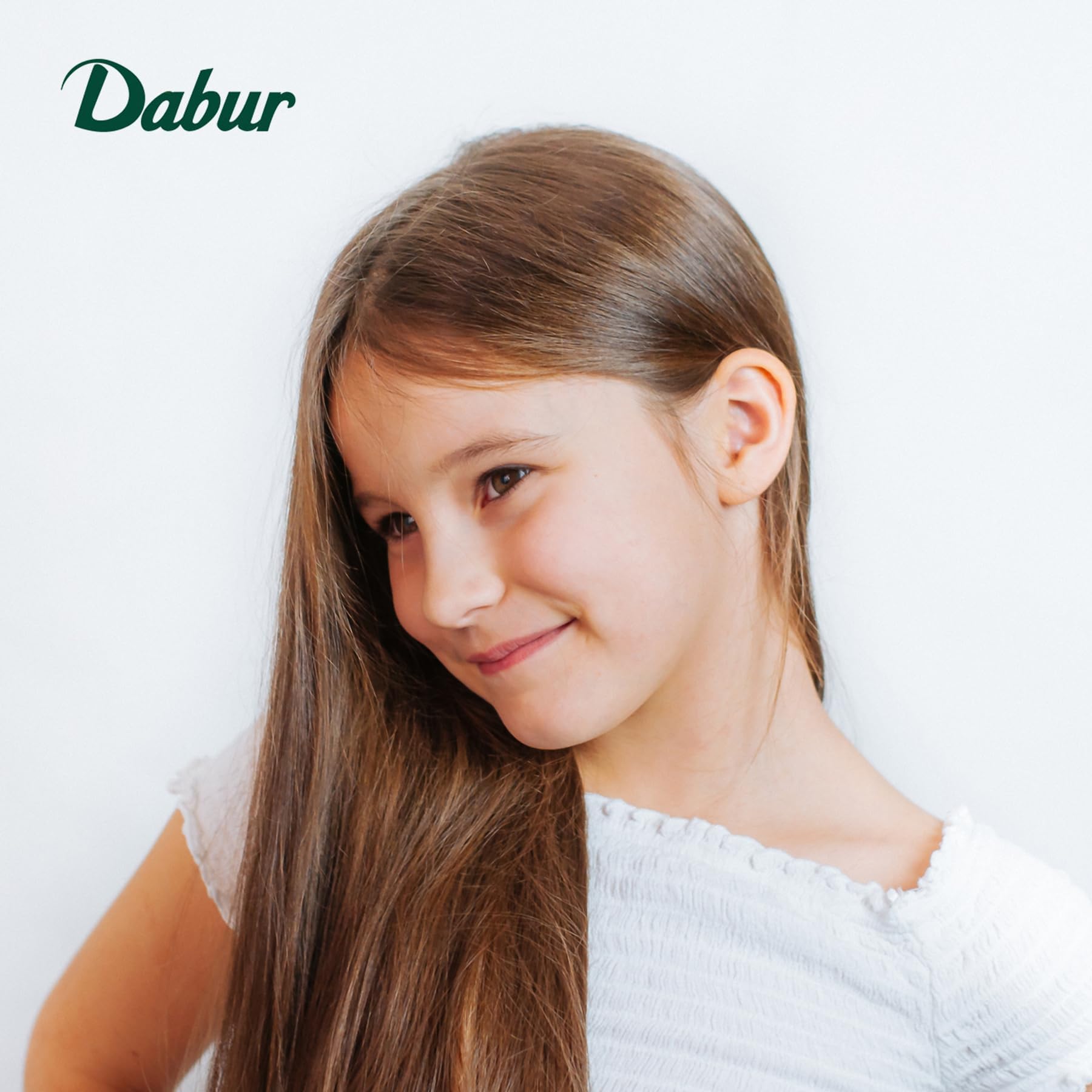Dabur child with neatly combed hair illustrating softer, manageable results