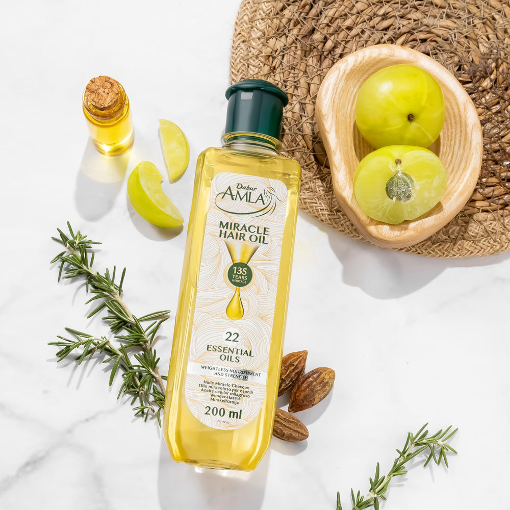 Dabur Amla Luxe scalp massage application demonstrating nourishment and root conditioning