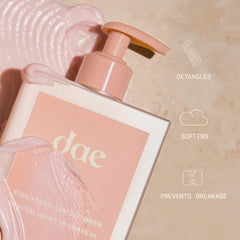 DAE conditioner cream pouring onto hair for smoothness